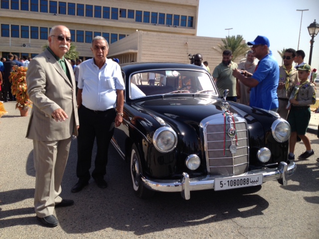 Belgassem Muntasser with his father's Mercedes 220S at the start of the rally