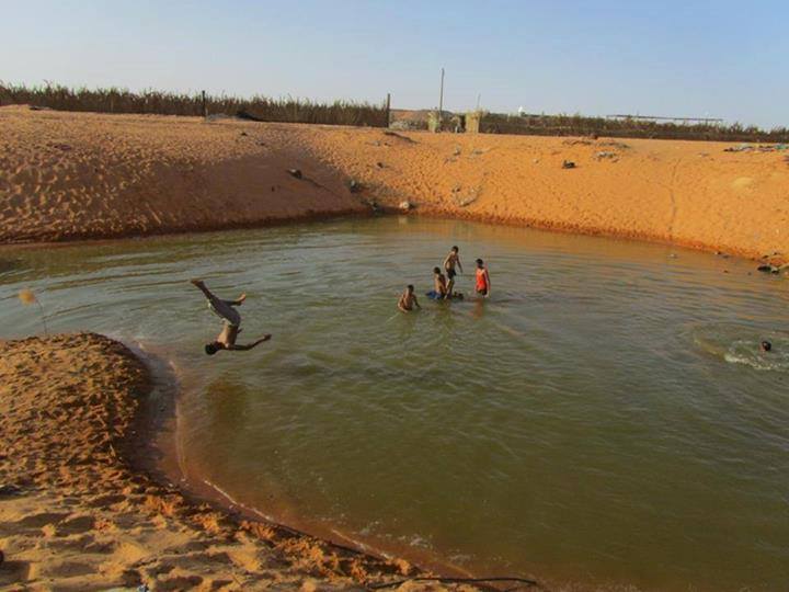 Local children enjoy Kufra Pond