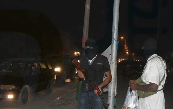 Masked guards in Benghazi's Leithie district this evening