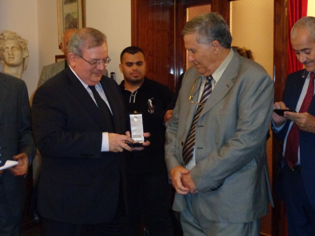 Greece's Ambassador in Tripoli, Kyriakos Amiridis presents Libyan Archaeology and Ancient Languages Dr Fadel Ali Mohamed was honoured with the Golden Order of the Phoenix (Photo: Sami Zaptia).