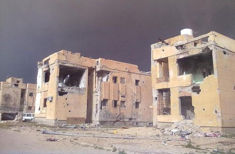 Homes in Sirte damaged during the revolution