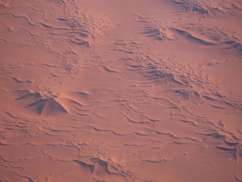 Figure 4: An aerial view of the complex dunes in Idhan Obari. Note the star dunes with several different prevailing wind directions and more than one slip face. Barachanoid and transverse dunes dominate the terrain. (Photo courtesy of Franco-Libyan Palaeontological Project.)