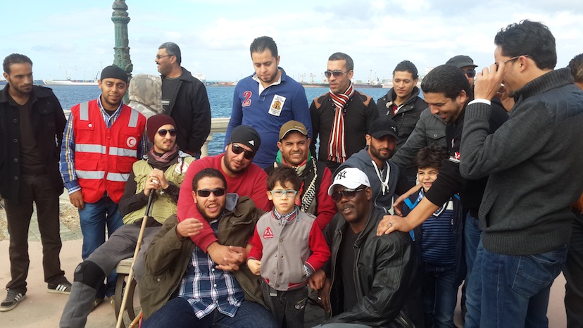 Abu Sala with friends and fans in Tripoli at the end of his walk for peace