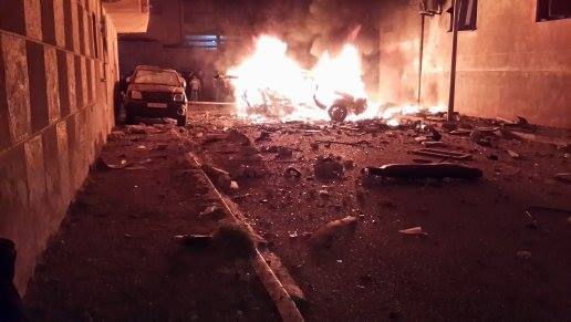 a bombed vehicle blazes in Derna this evening