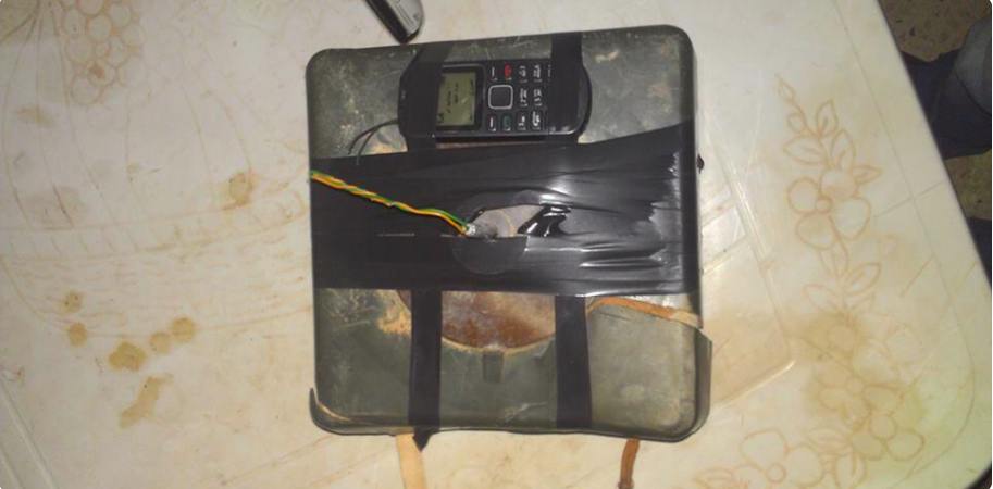 A photo apparently showing a bomb planted outside Benghazi medical centre of a similar type of with a mobile telephone detonator attached