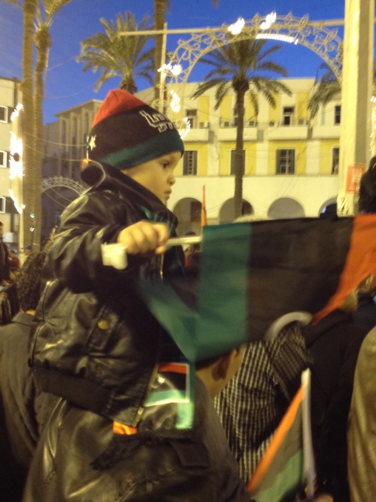 A small child waving a flag in Tripoli's Martyrs' Square last night (Photo: To Westcott)