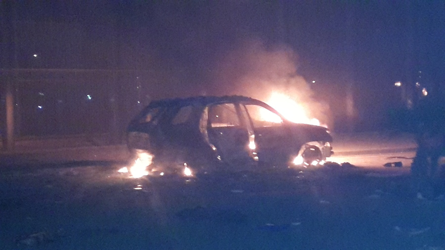 A burning car outside Congress this evening (Photo: Ahmed Elumami)