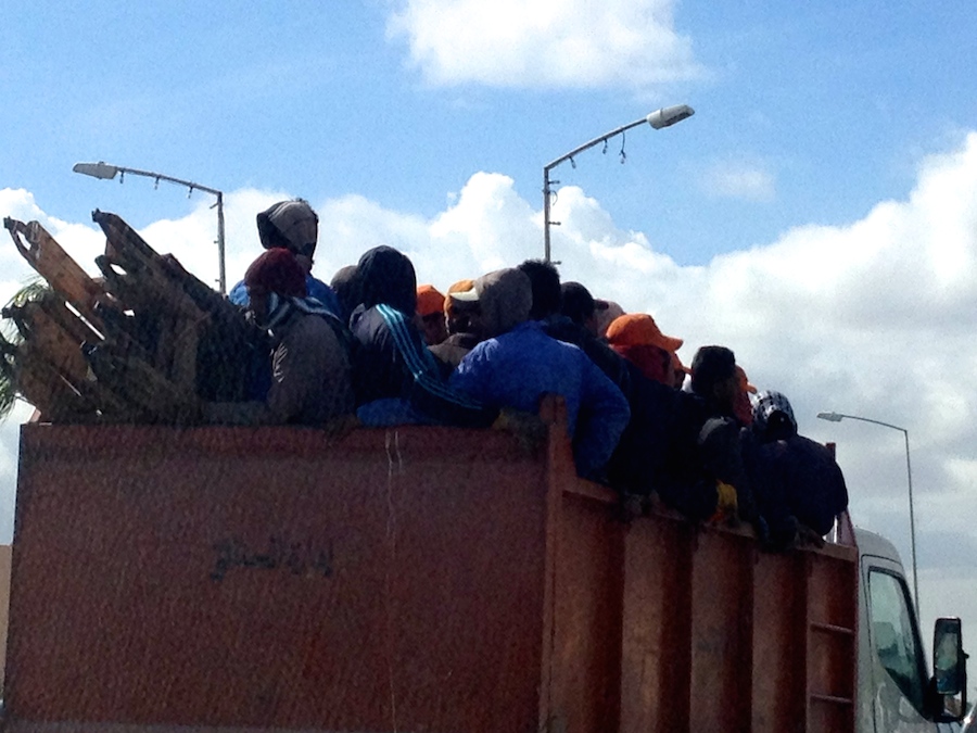 Migrant workers in Tripoli on to (Photo: Tom Westcott)
