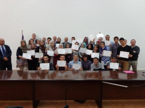 British ambassador Micheal Aron in the middle of Tripoli university language students who helped with interpretation with Libyan soldiers to be sent for training in the UK (Photo: Sami Zaptia).