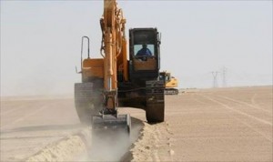 A bulldozer begins work on the trench in Jalu in January 2014 (Photo: social . . .[restrict]media)