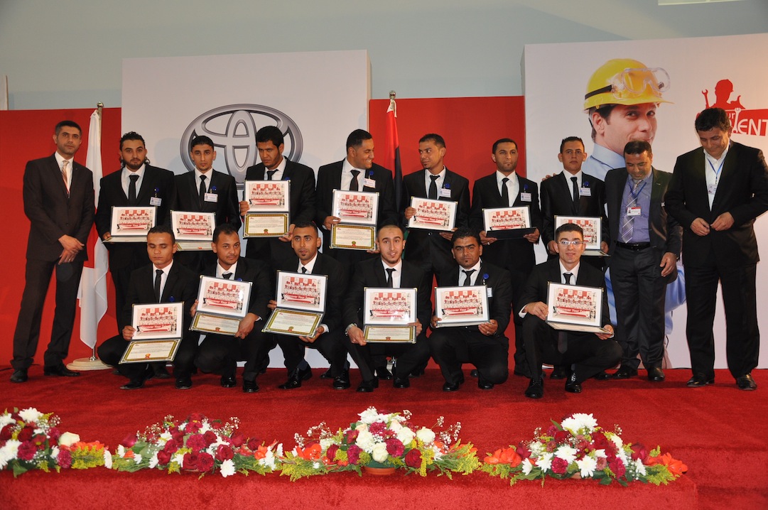 The new graduates hold their certificates (Photo: Toyota Libya)