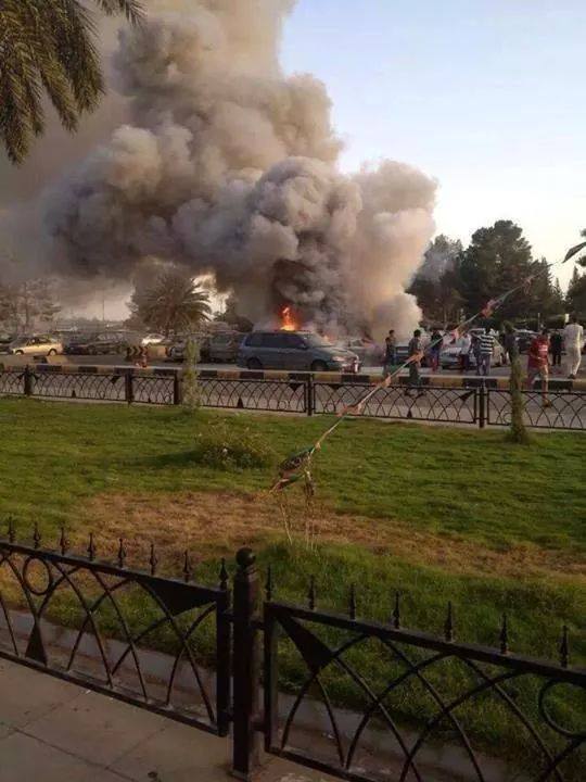 Smoke billows from the car park at Tripoli Airport . . .[restrict](Photo: Social Media)