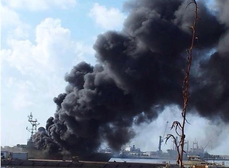 Plumes of smoke billow from a Libya Navy vessel hit in today's clashes (Photo: Social Media)