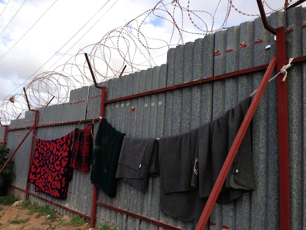 UNHCR blankets hung out to dry in the camp (Photo: Tom Westcott)