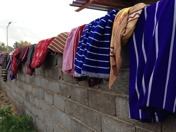 Residents dry their soaked garments and linen (Photo: Tom Westcott)