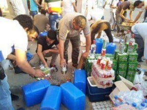 Customs men getting rid of seized alcohol (File photo)