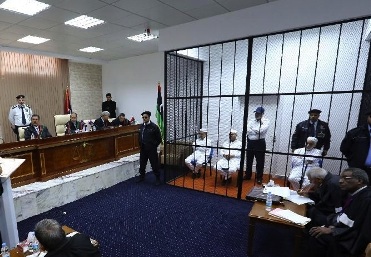 Baghdad Mahmoudi and co-defendents in court 