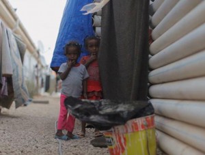 Tawerghan children outside their fragile glassfibre pipe home (Photo:social media)