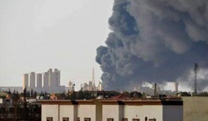 A pall of smoke rises near Benghazi'sHawari cement factory today (Photo: social media)