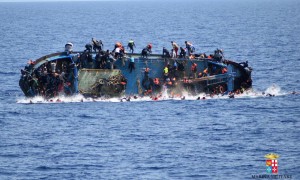 A boat carrying Illegal migrants that had sailed from Libya capsizing in the Mediterranean at the end of May (Source: Italian Navy).