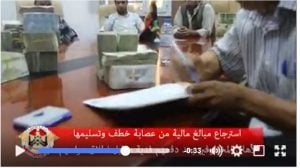 At a meeting, Rada returns ransom money to family members of kidnap victims (Photo from a Rada video).