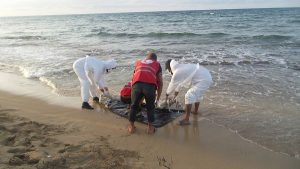 Libyan Red Crescent workers clear away one of the bodies (Photo: social media)