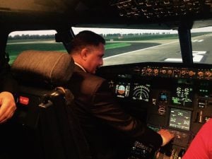 In the pilot’s seat in a demonstration in one of the ATCT simulators, Transport Minister Matouk, engrossed by the process, appears to make both a safe take-off and landing (Photo: Libya Herald)