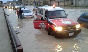 A Libyan Red Crescent ambulance acting as the Automobile Association to cars stranded in deep rainwater on Tripoli's roads (Photo: Libyan Red Crescent).