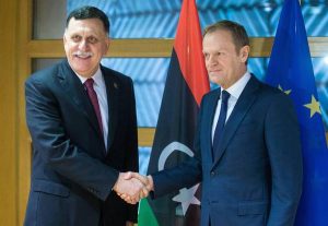 epa05766029 Prime Minister of Libya Fayez al-Sarraj (L) is welcomed by the President of the European Council Donald Tusk (R) ahead of a meeting at EU Council in Brussels, Belgium, 02 February 2017. EPA/STEPHANIE LECOCQ