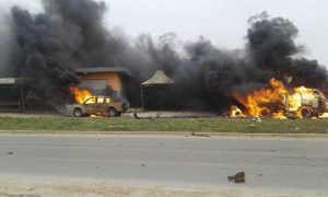 Burning vehicles from convoy attack