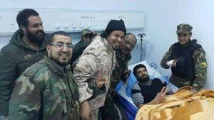 The injured Mahmoud Warfali at the BMC with Fadl Ai-Hassi (black hat) (Photo: social media)