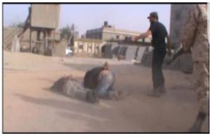 Photos believed to be taken in January and February 2017, according to a UN report, showing Mahmud al-Warfalli of the LNA executing several unidentified individuals (UN Libya Experts Panel report 2017). 