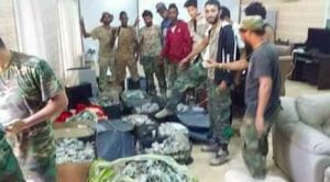 Saiqa members with cash-stuffed suitcases (Photo: social media)
