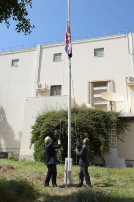 Johnson and Millett running up the British flag (Photo: UK embassy)