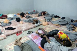 Refugees and migrants sleep on the floor at the Tariq al-Sikka detention facility in Tripoli, Libya. © UNHCR/Iason Foounten