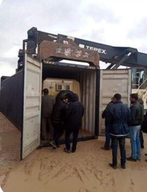 An armoured vehicle in a container seized by customs at Khoms port last week (Photo: Social media).